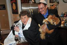 Lee Day (left) celebrates at a recent bark mitzvah.® Day trademarked the name and travels around  the country performing these doggy ceremonies.