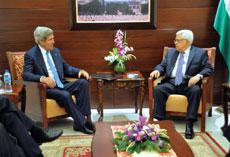 Palestinian Authority President Mahmoud Abbas (right), pictured here with Kerry, brought the 2010 talks to a halt by demanding an extension of settlement building freeze. (Amos Ben Gershom/GPO/Flash90)