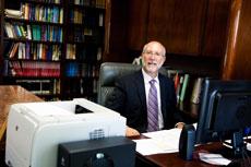 Rabbi Jay R. Goldstein wades through piles of notes to prepare his High Holiday sermon. (Justin Tsucalas)