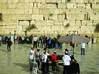 Men pray at the  Western Wall, Judaism's holiest site and the center of an escalating battle over women's prayer restrictions. 