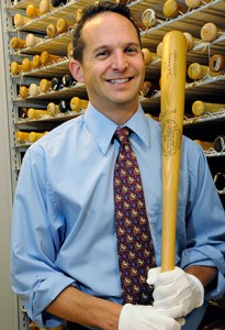 Jeff Idelson, Hall of Fame director, holds a bat used by the great Jewish Hall of Famer Hank Greenberg. (Milo Stewart Jr./National Baseball Hall of Fame)