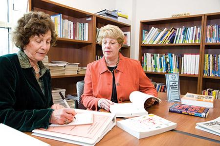 From left: Eva Schwartz, then-JCS director of economic services, and Barbara Levy Gradet; the JCS building (File photo)