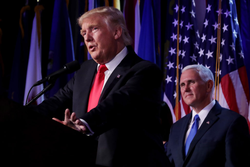 President-elect Donald Trump delivering his acceptance speech as Vice President-elect Mike Pence looks on at the New York Hilton Midtown in Manhattan, Nov. 9, 2016. (Chip Somodevilla/Getty Images) NEW YORK, NY - NOVEMBER 09: Republican president-elect Donald Trump delivers his acceptance speech as Vice president-elect Mike Pence looks on during his election night event at the New York Hilton Midtown in the early morning hours of November 9, 2016 in New York City. Donald Trump defeated Democratic presidential nominee Hillary Clinton to become the 45th president of the United States. (Photo by Chip Somodevilla/Getty Images)