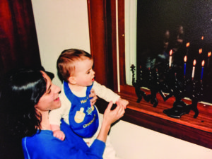 Keren McGinity teaches her daughter, Shira, about Chanukah. (Provided)