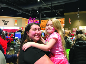 Saadya Baron and her daughter enjoy the JCC Chanukah event at the Foundry Row Wegmans. (Photo by JCC)