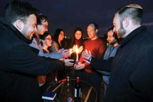 Moishe House grants resources to young Jewish residents who host various events that, in turn, draw in other young Jews. Events range from Shabbat dinners to social causes. (Moishe House)